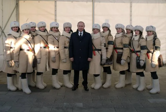 Russian President Vladimir Putin (C) poses for a picture with female participants during an event to commemorate the 75th anniversary of the Battle of Stalingrad in the World War Two while visiting the “Russia – My History” museum in the city of Volgograd (former Stalingrad), Russia, 02 February 2018. (Photo by Alexei Druzhinin/EPA/EFE/Sputnik/Kremlin)