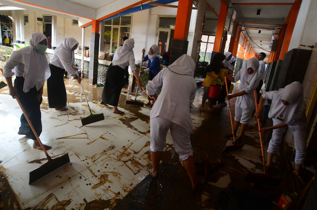 Nurses and workers clean up inside a hospital after a flash flood from heavy rains hit Garut, West Java, Indonesia September 21, 2016. (Photo by Adeng Bustomi/Reuters/Antara Foto)