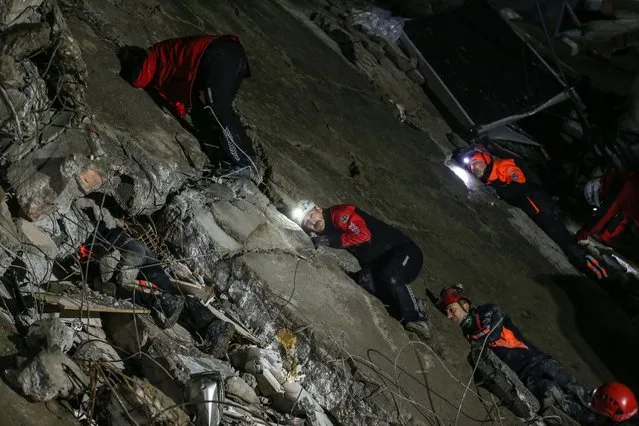 Emergency personnel during a search and rescue operation at the site of a collapsed building after an earthquake in Iskenderun district of Hatay, Turkey, 06 February 2023. Two earthquakes struck southern Turkey close to the Syrian border on 06 February 2023. Thousands of people have died and more than seven thousand have been injured in Turkey, according to AFAD,  theTurkish Disaster and Emergency Management Presidency. (Photo by Erdem Sahin/EPA/EFE/Rex Features/Shutterstock)