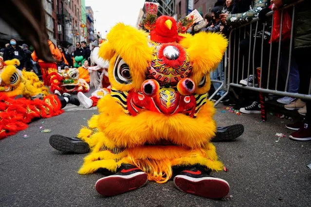 Lion dancers from the Choy Lay Fut Lion Dance team rest before the Lunar New Year parade celebrating the Year of the Rabbit in the Chinatown neighborhood of New York, U.S., February 12, 2023. (Photo by Bing Guan/Reuters)