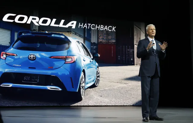 Jack Hollis, Vice President and General Manager for Toyota, speaks next to an image of a Corolla hatchback at the New York Auto Show in the Manhattan borough of New York City, New York, U.S., March 28, 2018. (Photo by Shannon Stapleton/Reuters)