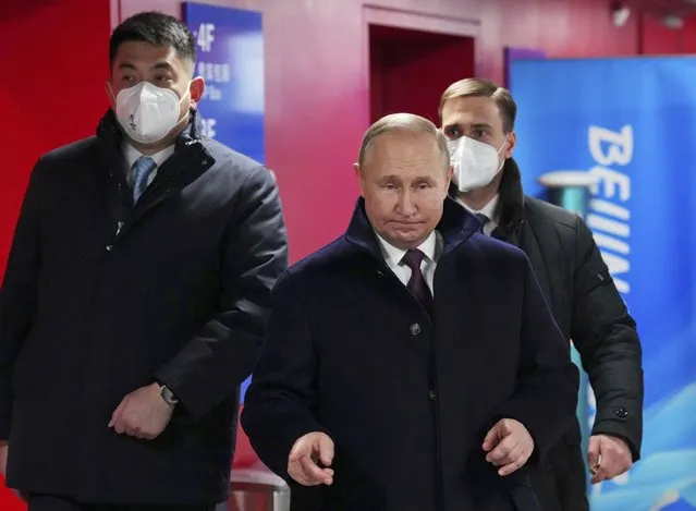 Russian President Vladimir Putin arrives for the opening ceremony of the 2022 Winter Olympics, Friday, February 4, 2022, in Beijing. (Photo by Carl Court/Pool Photo via AP Photo)
