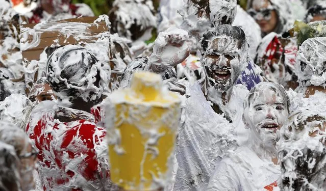 Students from St Andrews University are covered in foam as they take part in the traditional “Raisin Weekend” in the Lower College Lawn, at St Andrews in Scotland, Britain October 17, 2016. (Photo by Russell Cheyne/Reuters)