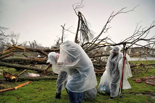 The McKnight family gather belongings from the wreckage of their home as Mississippi braces for another round of potentially severe weather after thunderstorms spawning high straight-line winds and tornadoes ripped across the state in Rolling Fork, Mississippi, U.S. March 26, 2023. (Photo by Cheney Orr/Reuters)