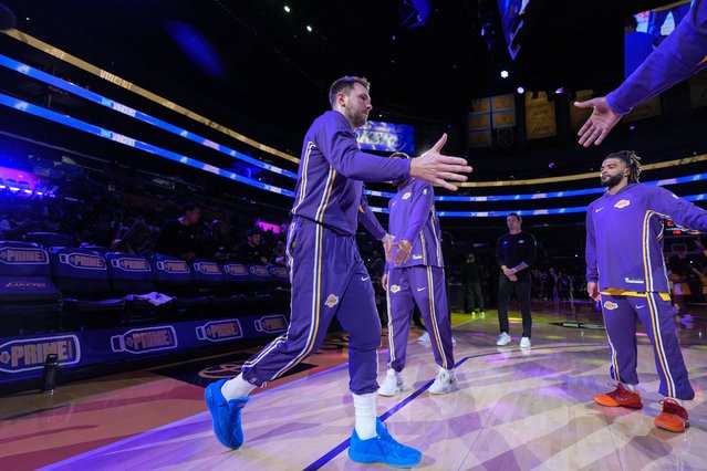 Los Angeles Lakers guard Luka Doncic, center, is introduced before the team's preseason NBA basketball game against the Sacramento Kings Friday, October 17, 2025, in Los Angeles. (Photo by Jae C. Hong/AP Photo)