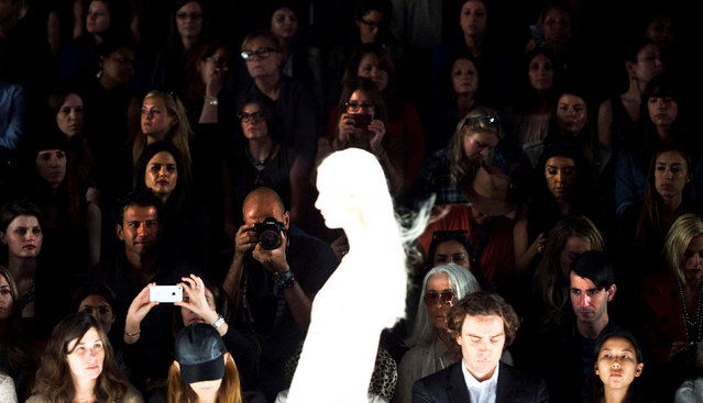 Audience members watch a model during the J. Mendel Spring/Summer 2013 show at New York Fashion Week, on September 12, 2012. (Photo by Andrew Burton/Reuters)