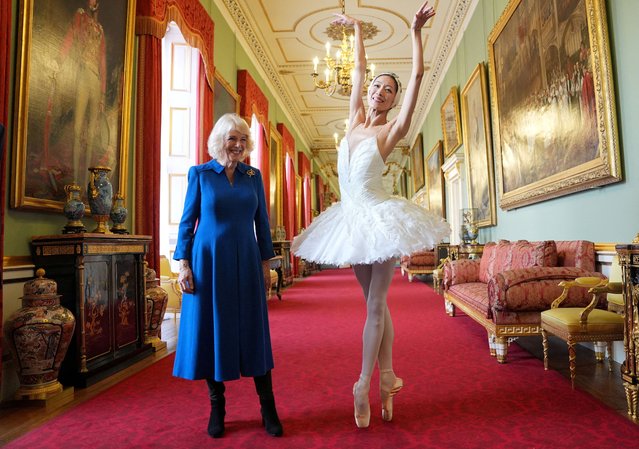 Britain's Queen Camilla, Patron of the English National Ballet, and ballerina Sangeun Lee, during a reception with staff, dancers, and supporters to celebrate the company's 75th anniversary and recognise the heritage, innovative creation of new works, and their learning and engagement programme, at Buckingham Palace in central London, Britain on Wednesday, November 12, 2025. (Photo by Yui Mok/Reuters)