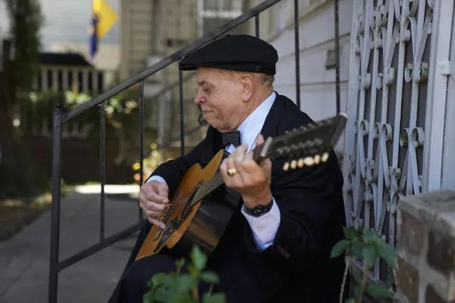 Guitarist and singer Deacon John Moore strums a guitar at his home in New Orleans, Wednesday, May 3, 2023. Moore has been a regular performer at the New Orleans Jazz & Heritage Festival since it began in 1970, and is playing the festival again this year. (Photo by Gerald Herbert/AP Photo)