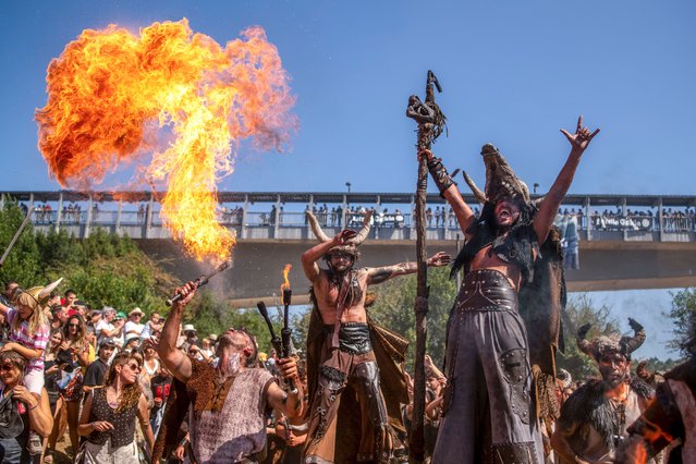 Participants stage a Viking invasion during the so-called “Romeria Vikinga” (lit.: Viking Pilgrimage) in the town of Catoira, Pontevedra province, Galicia region, north-western Spain, 04 August 2024. Celebrated since 1961 on the first weekend of August, the festival commemorates the role that the town of Catoira played in defending Galicia against Norman attacks. (Photo by Brais Lorenzo/EPA/EFE)