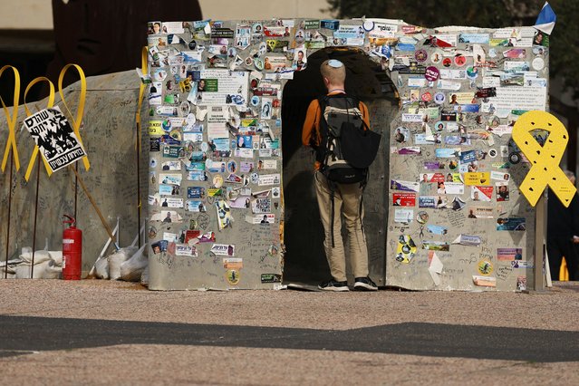 A person enters a makeshift tunnel symbolizing Hamas tunnels, built in support of the hostages kidnapped during the deadly October 7, 2023 attack by Hamas and who are still held in captivity, amid the ongoing conflict between Israel and Hamas, at the so-called “Hostages Square” in Tel Aviv, Israel, on January 14, 2025. (Photo by Kai Pfaffenbach/Reuters)