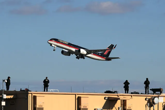 Secret Service counter-assault snipers watch as U.S. President-elect Donald Trump's airplane takes off at LaGuardia Airport en route to Indiana from New York, U.S., December 1, 2016. (Photo by Mark Kauzlarich/Reuters)