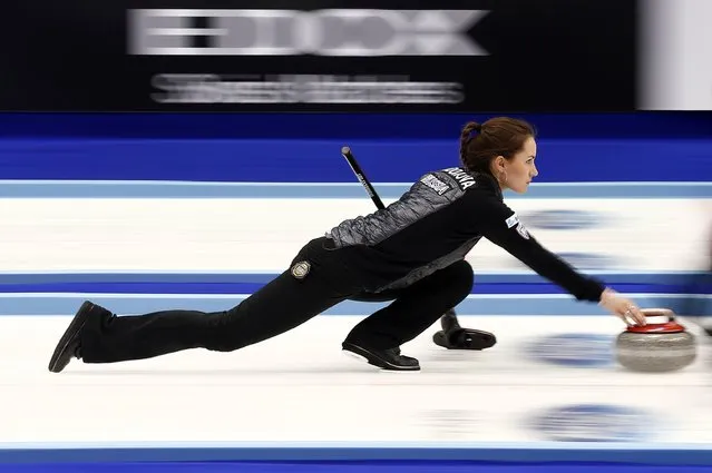 Russia's Anna Sidorova delivers a stone during their curling round robin game against Sweden at the World Women's Curling Championship in Sapporo March 16, 2015. (Photo by Thomas Peter/Reuters)
