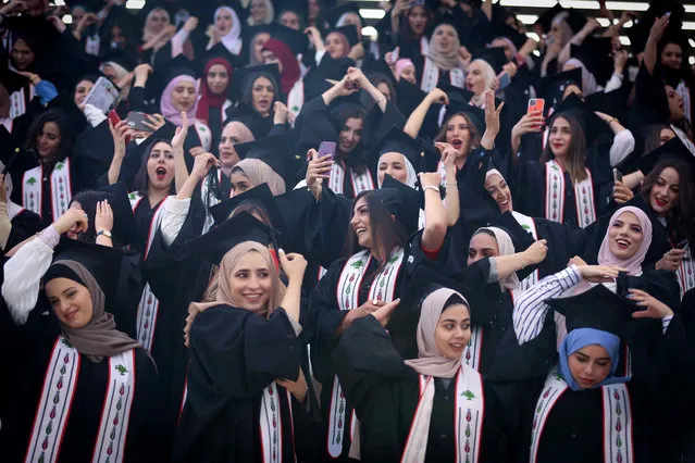 Palestinian students attend their graduation ceremony at Birzeit University in the West Bank city of Ramallah, on June 30, 2021. (Photo by APAImages/Rex Features/Shutterstock)