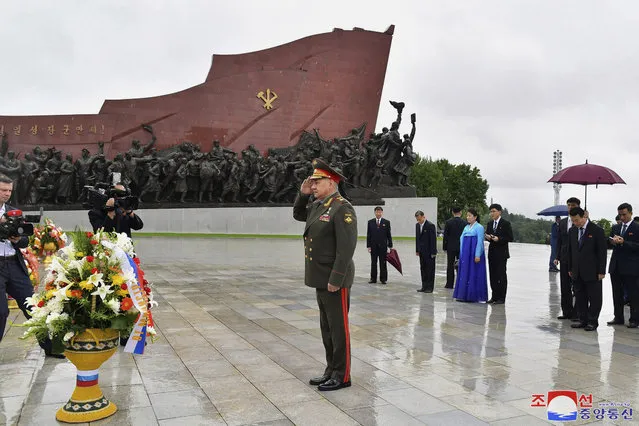 In this photo provided by the North Korean government, Russian Defense Minister Sergei Shoigu salutes as he lays a wreath of flowers in front of the statues of late North Korean leaders Kim Jong Il and Kim Il Sung on the occasion of the upcoming 70th anniversary of an armistice that halted fighting in the 1950-53 Korean War, in Pyongyang, North Korea, Wednesday, July 26, 2023. Independent journalists were not given access to cover the event depicted in this image distributed by the North Korean government. The content of this image is as provided and cannot be independently verified. Korean language watermark on image as provided by source reads: “KCNA” which is the abbreviation for Korean Central News Agency. (Photo by Korean Central News Agency/Korea News Service via AP Photo)