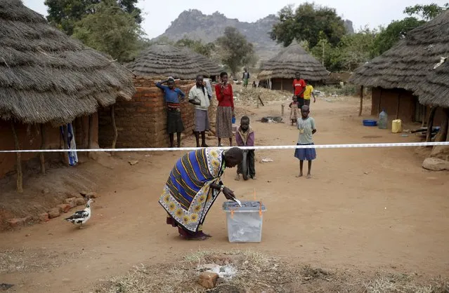 Karamojong tribeswoman casts her ballot at a polling station during the presidential elections in Kaabong in Karamoja region, Uganda, February 18, 2016. (Photo by Goran Tomasevic/Reuters)