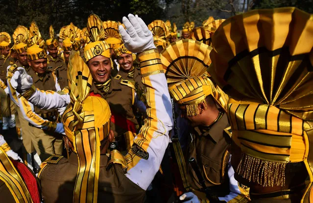 Indian members of the Central Industrial Security Force (CISF) dance as they wait to take part in a full dress rehearsal for the forthcoming Republic Day parade in Kolkata on January 24, 2017 The Crown Prince of Abu Dhabi Sheikh Mohamed bin Zayed Al Nahyan will be the chief guest of honour at India' s forthcoming 68 th Republic Day celebrations on January 26. (Photo by Dibyangshu Sarkar/AFP Photo)