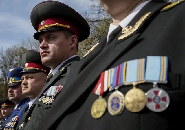 Ukrainian army officers attend a graduation ceremony at the National University of Defence of Ukraine in Kiev, April 24, 2015. (Photo by Gleb Garanich/Reuters)