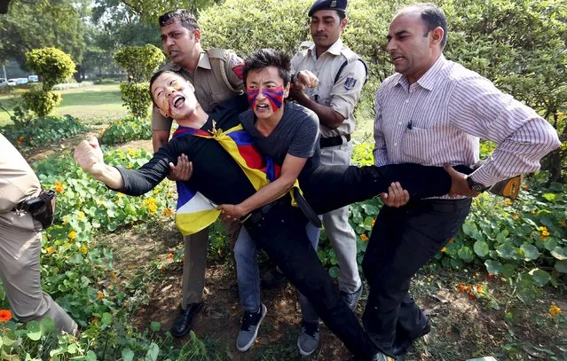 Indian police detain Tibetan activists during a protest held to mark the 57th anniversary of the Tibetan uprising against Chinese rule, outside the Chinese embassy in New Delhi, India, March 10, 2016. (Photo by Cathal McNaughton/Reuters)
