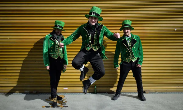 Revellers attend the Saint Patrick's Day parade on March 17, 2019 in Dublin, Ireland. Saint Patrick, the patron saint of Ireland is celebrated around the world on St. Patrick's Day. According to legend Saint Patrick used the three-leaved shamrock to explain the Holy Trinity to Irish pagans in the 5th-century after becoming a Christian missionary. (Photo by Charles McQuillan/Getty Images)