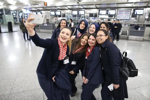 Flight operators take selfie in an empty hall of Ataturk Airport on the last day of flight operations of the airport in Istanbul, Turkey, late 05 April 2019. Ataturk airport operations will officially move to new Istanbul Airport on 05 April 2019. Moving will take 45 hours, 47 thousand 300 tons of material will be transported with 707 trucks. (Photo by Erdem Sahin/EPA/EFE)