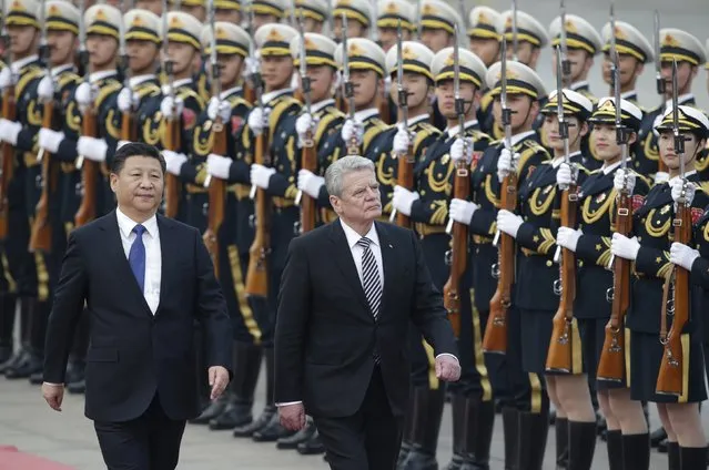 German President Joachim Gauck (R) and China's President Xi Jinping review honour guards during a welcoming ceremony at the Great Hall of the People in Beijing, China March 21, 2016. (Photo by Jason Lee/Reuters)