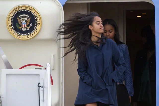 First daughters Sasha and Malia Obama exit Air Force One at Andrews Air Force Base, Md., Friday, March 25, 2016, as the family returned from Cuba and Argentina. (Photo by Cliff Owen/AP Photo)