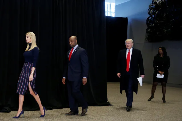 U.S. President Donald Trump is joined by his daughter Ivanka Trump (L) and U.S. Senator Tim Scott (R-SC) (2nd L) during his remarks after visiting the National Museum of African American History and Culture on the National Mall in Washington, U.S., February 21, 2017. Also pictured is White House aide Omarosa Manigault (R). (Photo by Jonathan Ernst/Reuters)