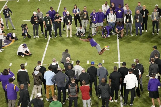 LSU wide receiver Gregory Clayton Jr. performs the broad jump during LSU's NCAA football pro day in Baton Rouge, La., Wednesday, March 27, 2024. (Photo by Gerald Herbert/AP Photo)