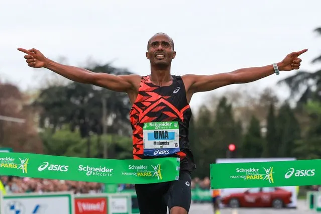Mulugeta Uma of Ethiopia crosses the finish line to win the men's marathon during the 2024 Paris Marathon, in Paris on April 7, 2024. (Photo by Emmanuel Dunand/AFP Photo)
