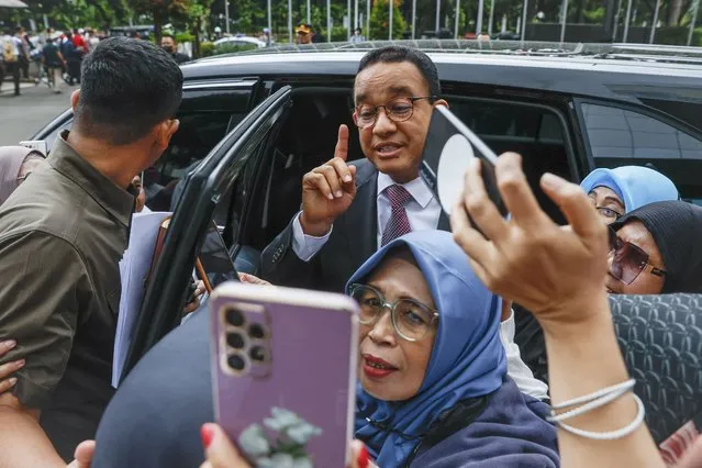 Presidential candidate Anies Baswedan (C) greets his supporters after a hearing session on the legal challenge against the presidential election result at the constitutional court in Jakarta, Indonesia, 27 March 2024. Legal cases were filed from losing presidential candidates Anies Baswedan and Ganjar Pranowo to challenge the Indonesian presidential election result after Prabowo Subianto and his running mate Gibran Rakabuming Raka won the presidential race in the world's largest single-day vote. (Photo by Mast Irham/EPA)