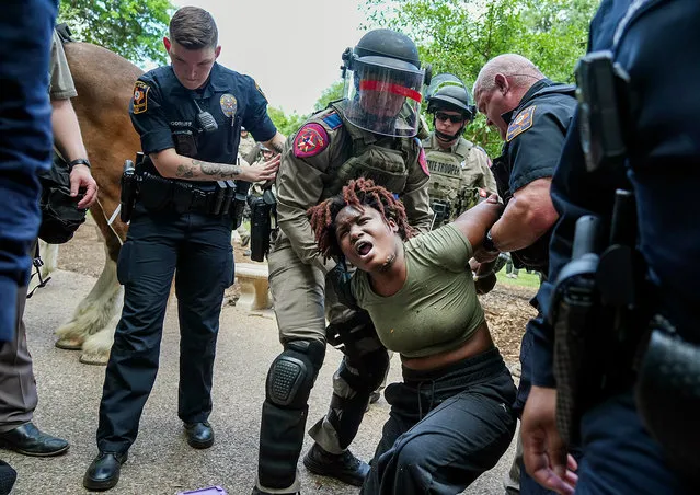 A demonstrator is arrested at a pro-Palestinian protest at the University of Texas, Wednesday, April 24, 2024, in Austin, Texas. (Photo by Ricardo B. Brazziell/Austin American-Statesman via AP Photo)