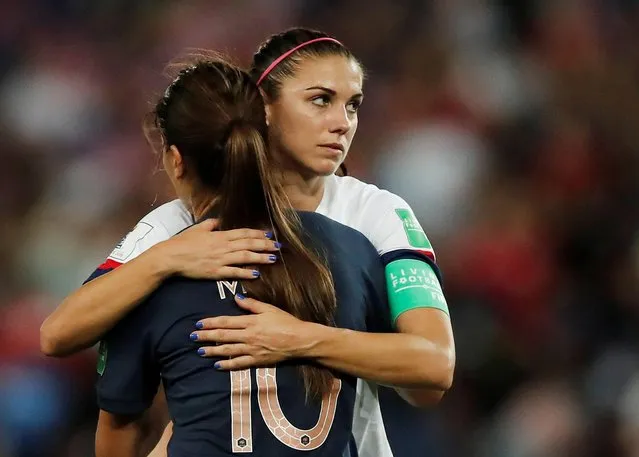 France's defender Amel Majri (L) is comforted by United States' forward Alex Morgan at the end of the France 2019 Women's World Cup quarter-final football match between France and USA, on June 28, 2019, at the Parc des Princes stadium in Paris. (Photo by Benoit Tessier/Reuters)