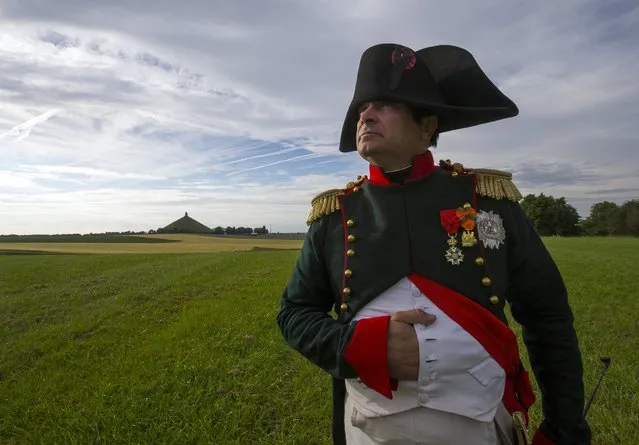 Frenchman Frank Samson who is taking part in an re-enactment of the Battle of Waterloo poses in front of the  Lion's Mound of Waterloo during the bicentennial celebrations for the Battle of Waterloo, in Waterloo, Belgium June 17, 2015. The commemorations for the 200th anniversary of the Battle of Waterloo will take place in Belgium on June 19 and 20.   REUTERS/Yves Herman REUTERS/Yves Herman