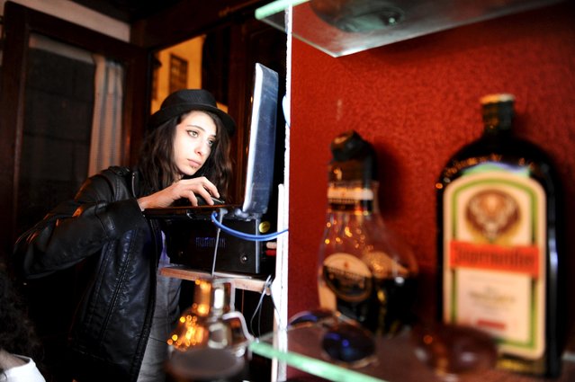 Marah, a DJ at 80s Bar, plays music in Damascus, Syria March 13, 2016. (Photo by Omar Sanadiki/Reuters)