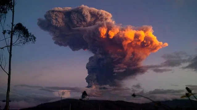 The Tungurahua volcano spews a column of ash as seen from Ambato, Ecuador, on April 4, 2014. The volcano spewed a 6-mile column of ash after a powerful five-minute explosion that shot pyroclastic material onto its northern and northwestern flanks. (Photo by Associated Press)