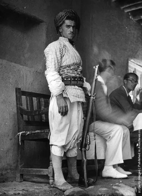 1941: An Iranian soldier guards two German tourists near the Iranian-Turkish border during World War II. Since the British occupation of Iran, all Axis nationals are being expelled from the country