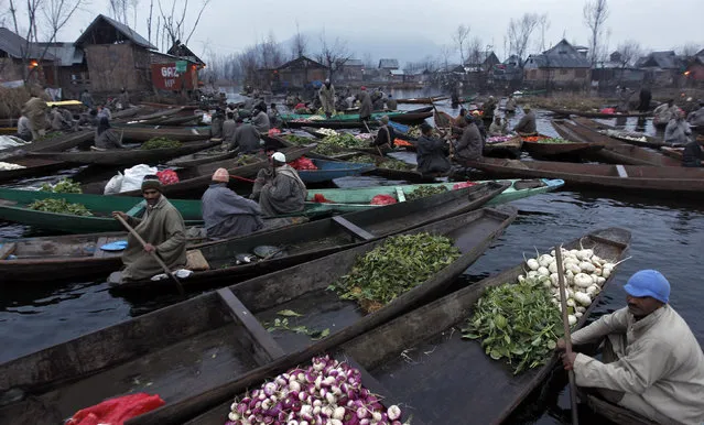 Kashmiri vegetable vendors assemble at a floating market in the interiors of the Dal Lake in Srinagar January 14, 2011. (Photo by Danish Ismail/Reuters)