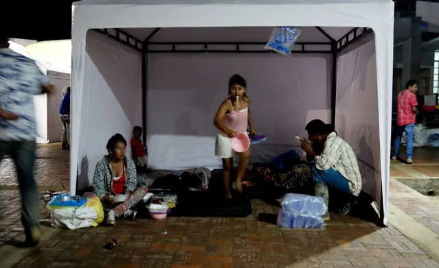 People rest in a shelter after a landslide in Mocoa, Colombia, 02 April 2017. Forensic authorities in Colombia said on 02 April that the death toll rose to 248 people in the Mocoa landslide that left hundreds injured. (Photo by Leonardo Munoz/EPA)