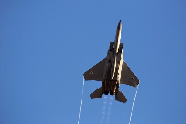 An Israeli air force F-15 fighter jet flies during an exhibition as part of a pilot graduation ceremony at the Hatzerim air base in southern Israel on June 26, 2014. (Photo by Amir Cohen/Reuters)