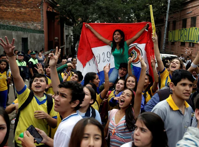 Students on the street in front of Republica Argentina school celebrate after Paraguay's Education Minister Marta Lafuentein resigned in Asuncion, Paraguay, May 5, 2016. (Photo by Jorge Adorno/Reuters)