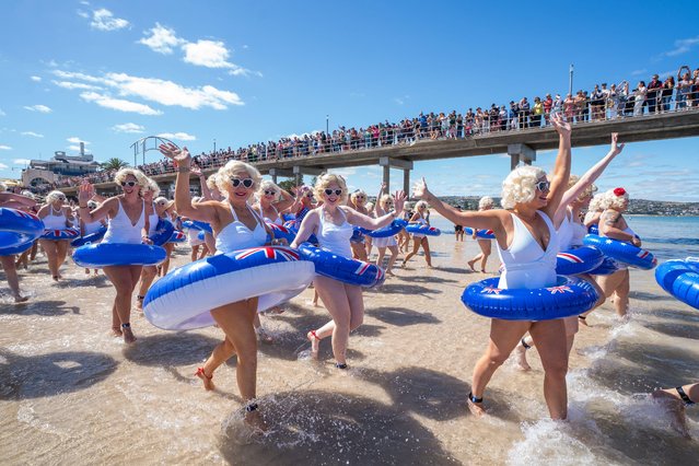 Hundreds of women and men “Marilyns” in white bathing costumes and blonde wigs take to the water in the Brighton Jetty Classic, Adelaide, Australia on February 5, 2023, as homage to the Hollywood icon Marilyn Monroe . The Marilyn swim event was founded by Sarah Tinney and involves swimming 400 metres around Brighton Jetty, Adelaide to raise funds for cancer research (Phoot by Amer Ghazzal/Alamy Live News)