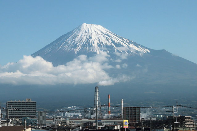 Mount Fuji is pictured in Fuji City, Shizuoka prefecture, Japan, 10 April 2024 (issued 07 June 2024). On 07 June, Masahiro Kubota of the Fuji City Exchange and Tourism Division confirmed that a metal fence will be installed in July to block tourists' access to a famous photo spot at Mount Fuji Dream Bridge. In the meantime, the city installed temporary toilets and a parking lot to cope with the flow of foreign tourists. (Photo by JIJI Press/EPA)