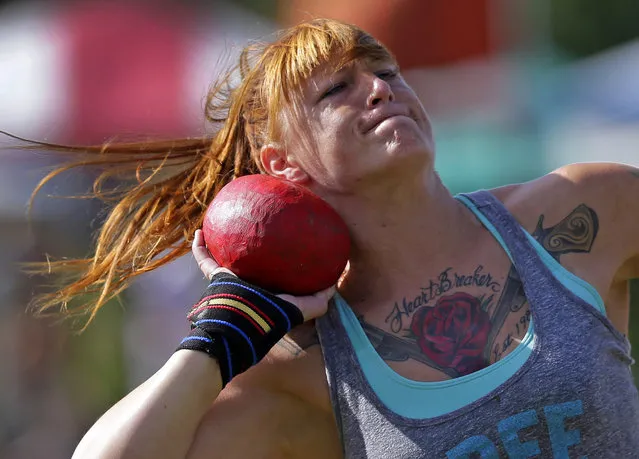 Amanda Ford, of Wilmington, N.C., prepares to throw the 8 pound stone during the 59th annual Grandfather Mountain Highland Games in Linville, N.C., Friday, July 10, 2015. This is the first year women have been allowed to compete in the games. (Photo by Chuck Burton/AP Photo)