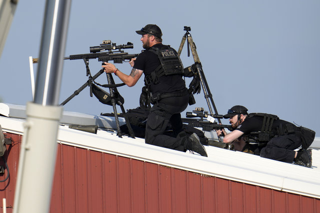 Police snipers return fire after shots were fired while Republican presidential candidate former President Donald Trump was speaking at a campaign event in Butler, Pa., on Saturday, July 13, 2024. (Photo by Gene J. Puskar/AP Photo)