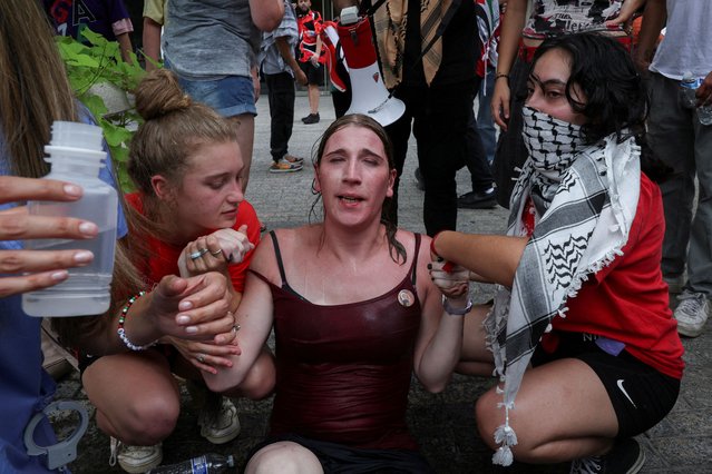 A pro-Palestinian demonstrator gets her eyes washed after police used pepper spray on protesters, on the day Israeli Prime Minister Benjamin Netanyahu addresses a joint meeting of Congress, on Capitol Hill, in Washington, U.S., July 24, 2024. (Photo by Umit Bektas/Reuters)