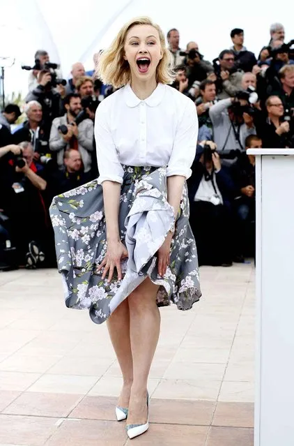 Actress Sarah Gadon reacts as her skirt is blown by the wind as she poses for photographers during a photo call for Maps to the Stars at the 67th international film festival, Cannes, southern France, Monday, May 19, 2014. (Photo by Alastair Grant/AP Photo)