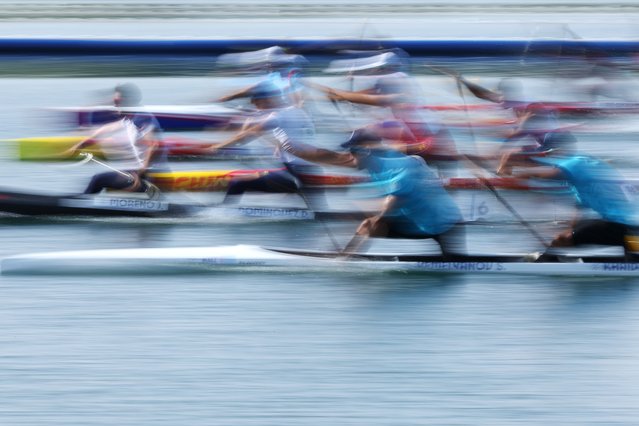 An image taken with slow shutter speed shows Sergey Yemelyanov (front L) and Timur Khaidarov (front R) of Kazakhstan compete during the Men's Canoe Double 500m heats of the Canoeing Sprint competitions in the Paris 2024 Olympic Games, at the Vaires-sur-Marne Nautical Stadium in Vaires-sur-Marne, France, 06 August 2024. (Photo by Maxim Shipenkov/EPA/EFE)