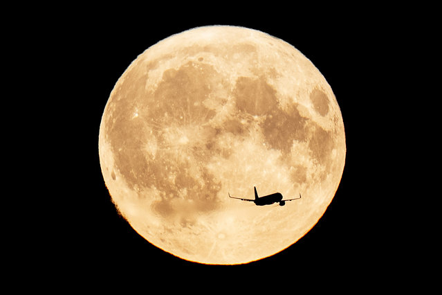 A supermoon is seen from Kastellet in Copenhagen on Monday, August 19, 2024. (Photo by Thomas Traasdahl/Ritzau Scanpix via AP Photo)