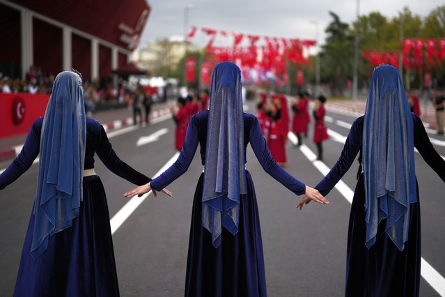 Women perform during an event for Victory Day, in Istanbul, Friday, August 30, 2024. Friday's events commemorate the 102nd anniversary of Victory Day, marking the end of a battle with Greek forces in western Anatolia. The conflict was part of the Turkish War of Independence led by Mustafa Kemal Ataturk, the founder of the Turkish Republic. (Photo by Khalil Hamra/AP Photo)