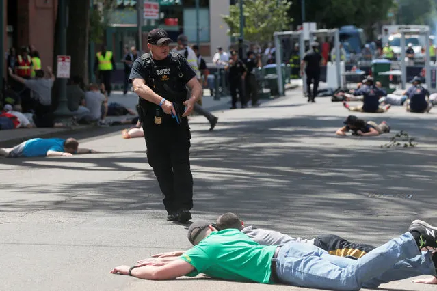 Boston Police officers and volunteers take part in an active shooter drill at Fenway Park in Boston, Massachusetts, U.S. June 12, 2016. (Photo by Brian Snyder/Reuters)